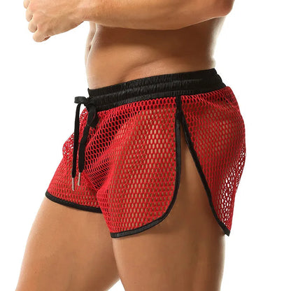 Men's solid colour loose fit polyester boxer shorts shown in black, white, grey, and red.
