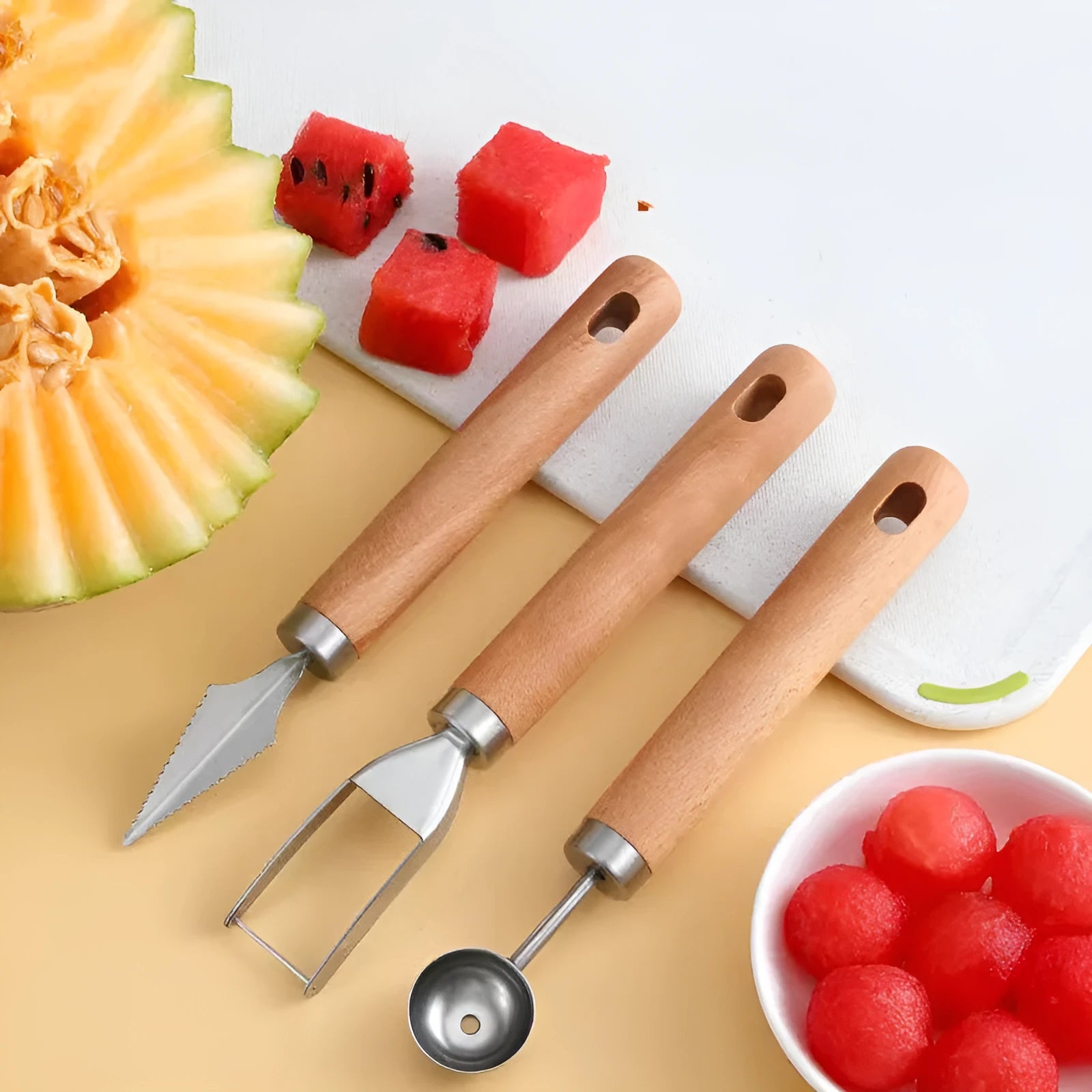 Stainless steel watermelon cutting tools with wooden handles including fruit knife, carving knife and ball cutter