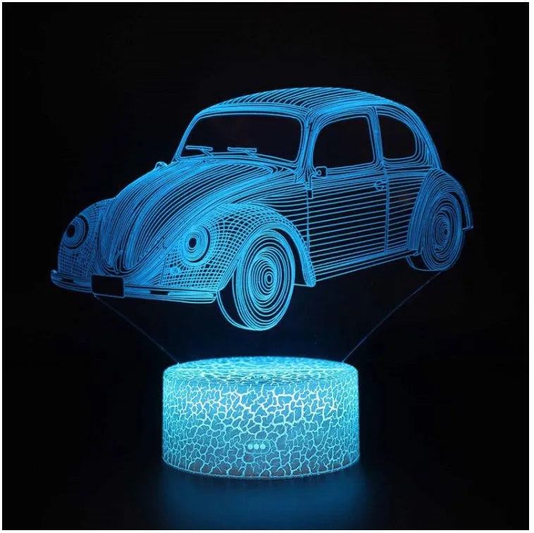 Colourful 3D LED table lamp with remote control and USB cable on wooden desk