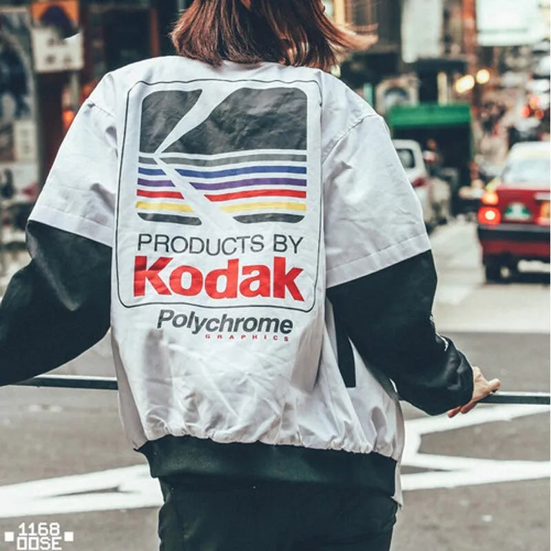 Hip hop style baseball jacket in grey or white with streetwear print, round neck, and side slit pockets.