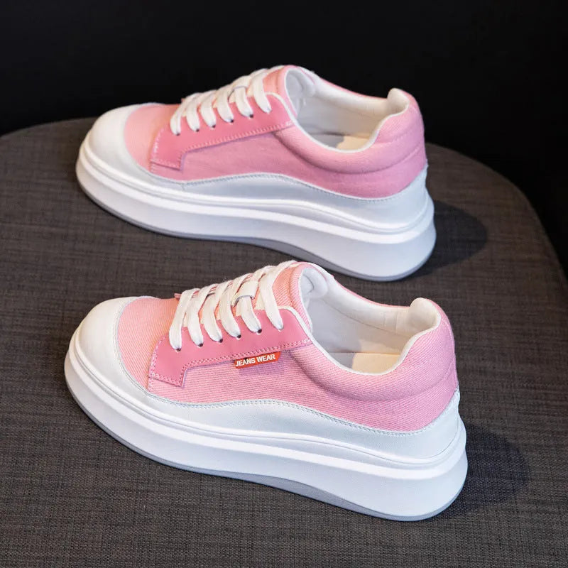 Women's pink leather board shoes with thick height-increasing sole on beige background