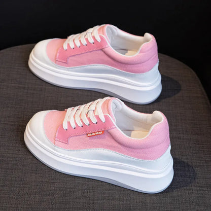 Women's pink leather board shoes with thick height-increasing sole on beige background