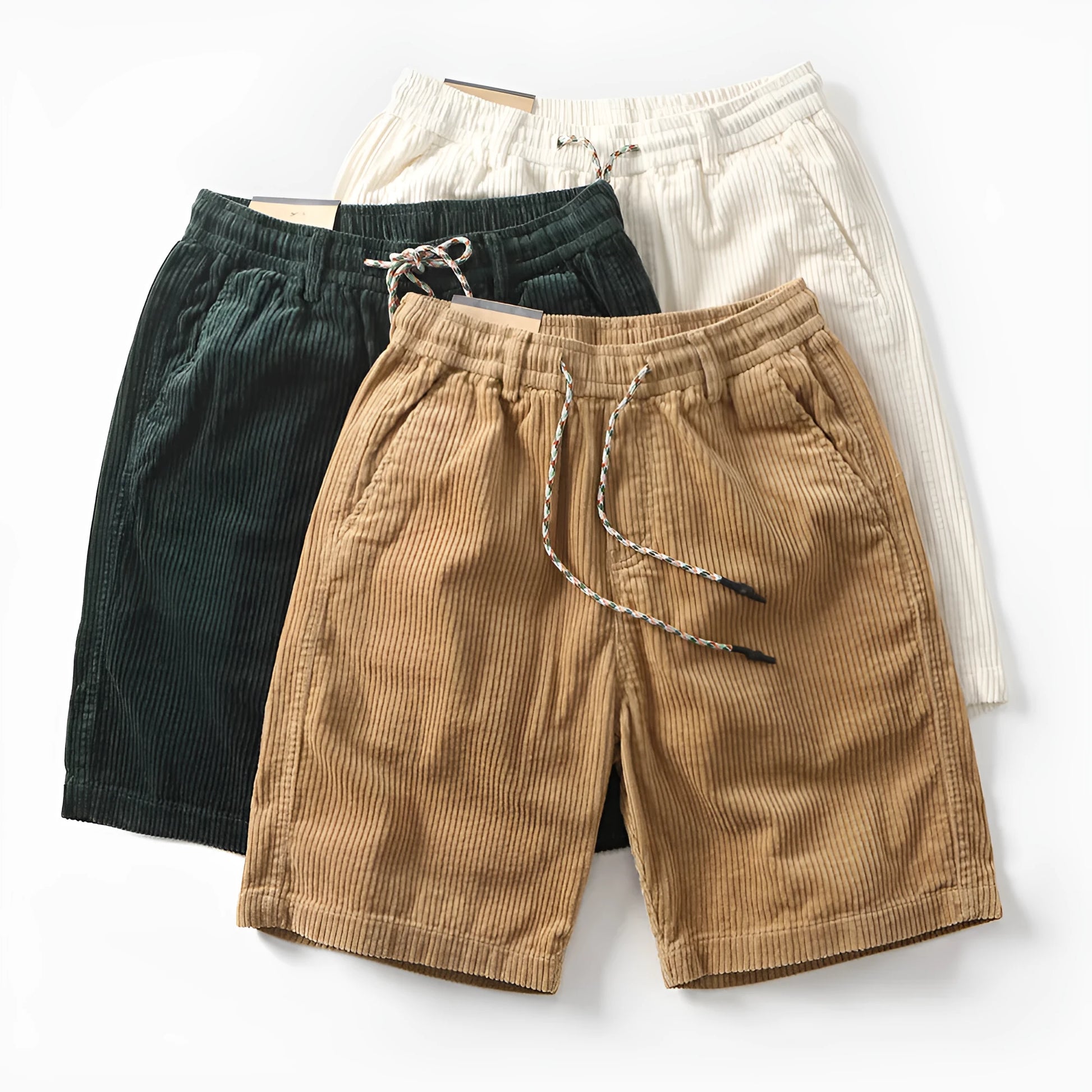Men's khaki straight-leg cargo shorts with utility pockets, shown in a streetwear style.
