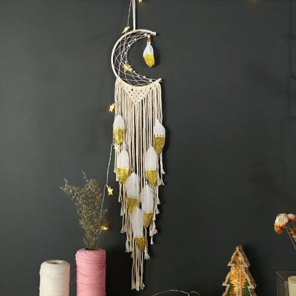 Gold crescent dream catcher wall decoration made from woven cotton thread, 20cm wide by 100cm high.