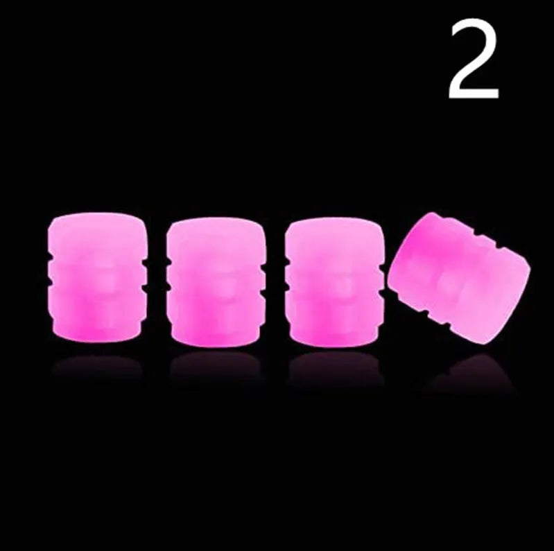 Glow-in-the-dark rubber tyre valve caps in five colour options on tyre valve stem