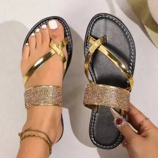 Women's flat beach sandals with rhinestone toe strap in black, gold or silver colours