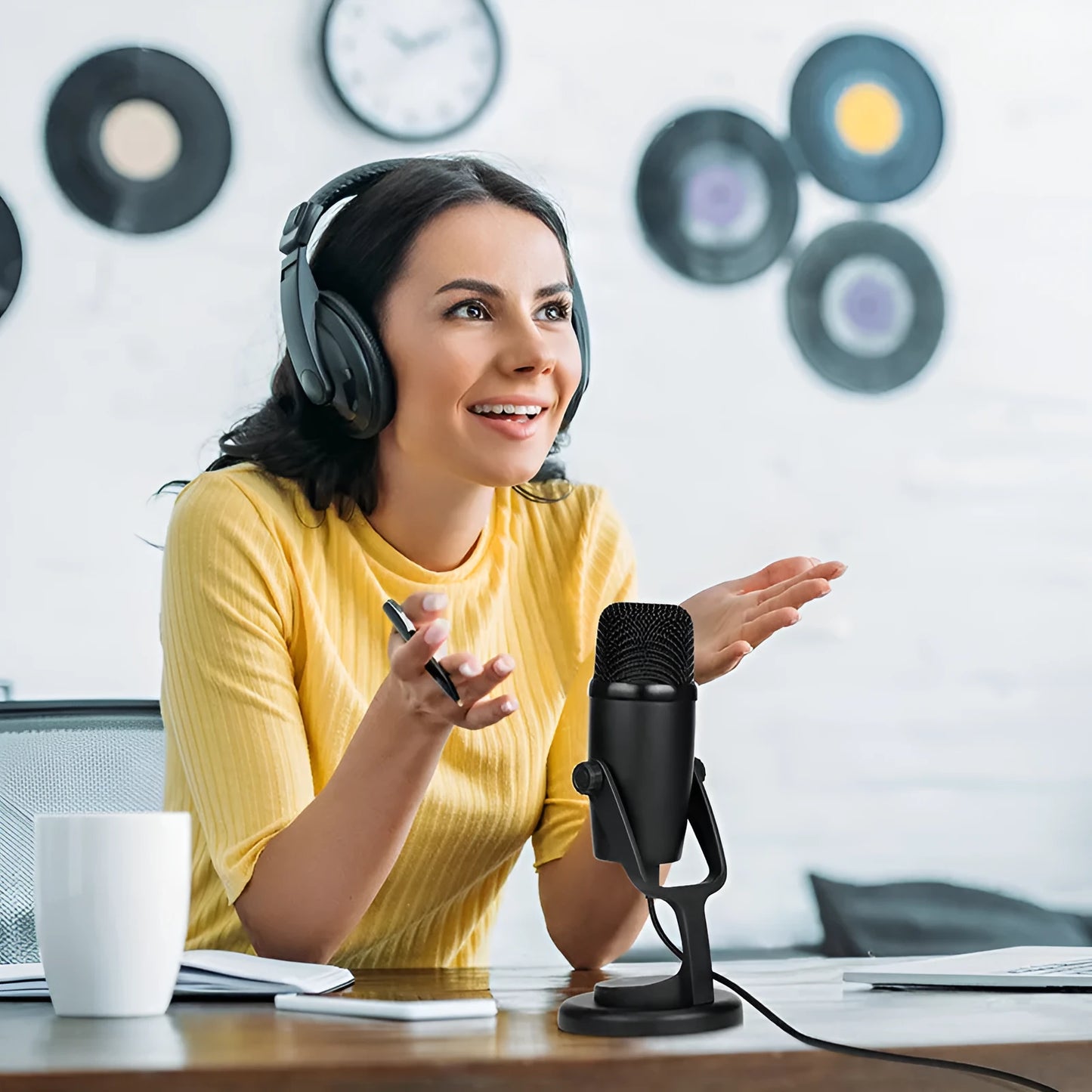 Black Boya BY-PM500 USB microphone with built-in sound card on a desktop.