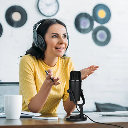 Black Boya BY-PM500 USB microphone with built-in sound card on a desktop.