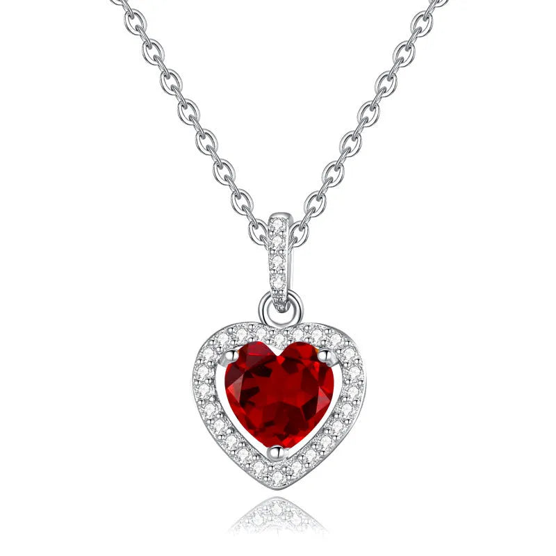 S925 sterling silver necklace with a heart-shaped pendant featuring a round natural gemstone on a cross chain.