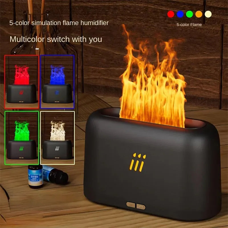 Black ultrasonic flame aroma diffuser humidifier with LED lights on a wooden table