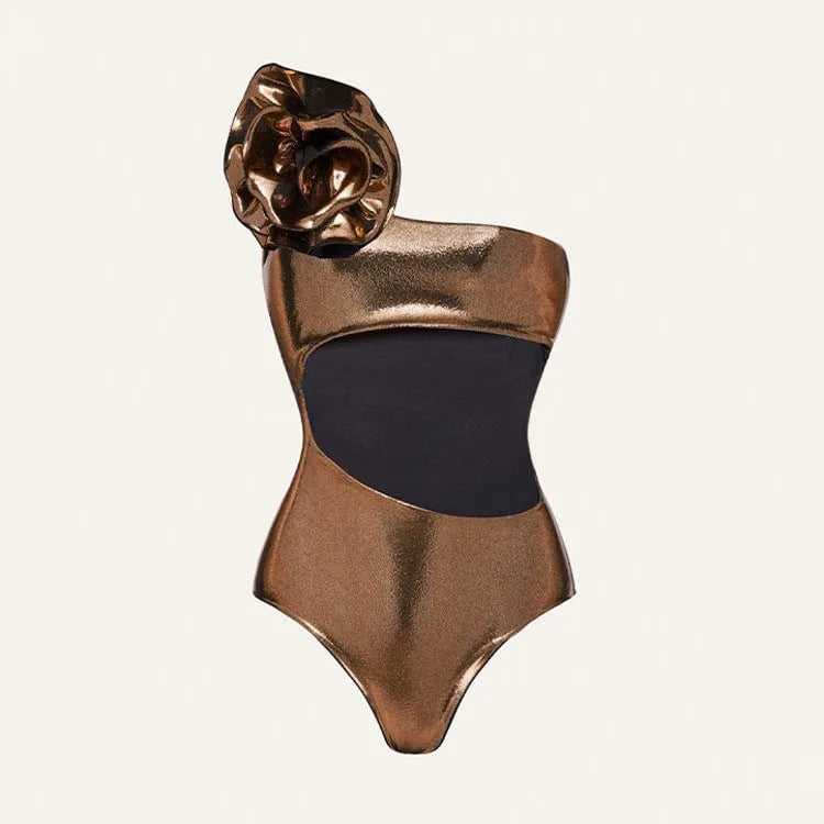 Gold handmade halter one-piece swimsuit with hollow out floral pattern on a mannequin.
