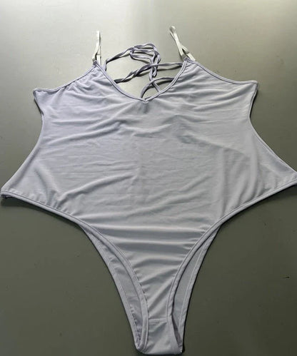 A stylish, backless one-piece swimsuit in a variety of vibrant colors for women's summer fashion.