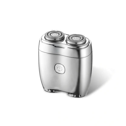 Silver portable electric shaver with floating double cutter heads, USB charging port, and rubberised grip
