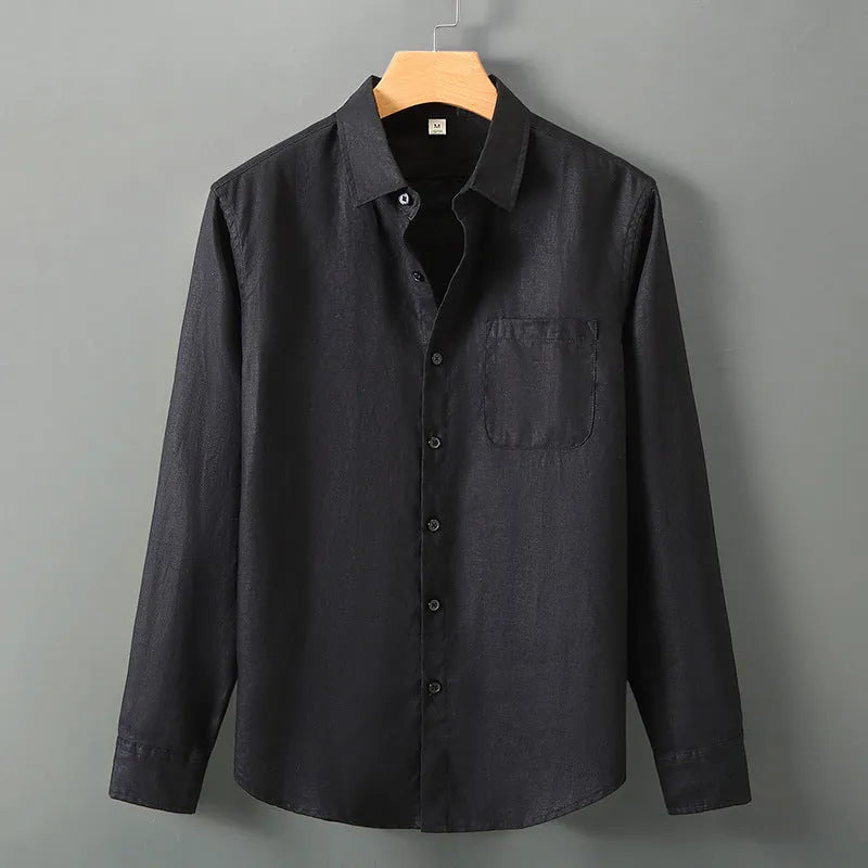 Man wearing a loose-fit light grey long sleeve linen cardigan shirt with a Chinese style design.