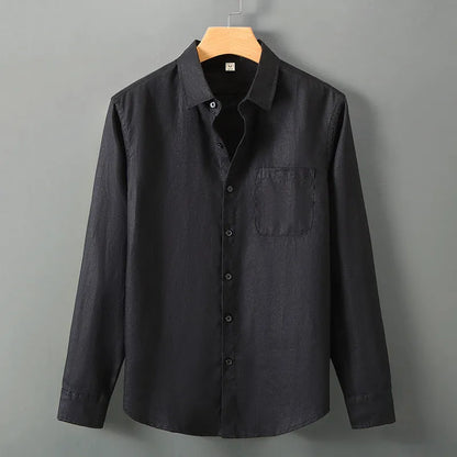 Man wearing a loose-fit light grey long sleeve linen cardigan shirt with a Chinese style design.