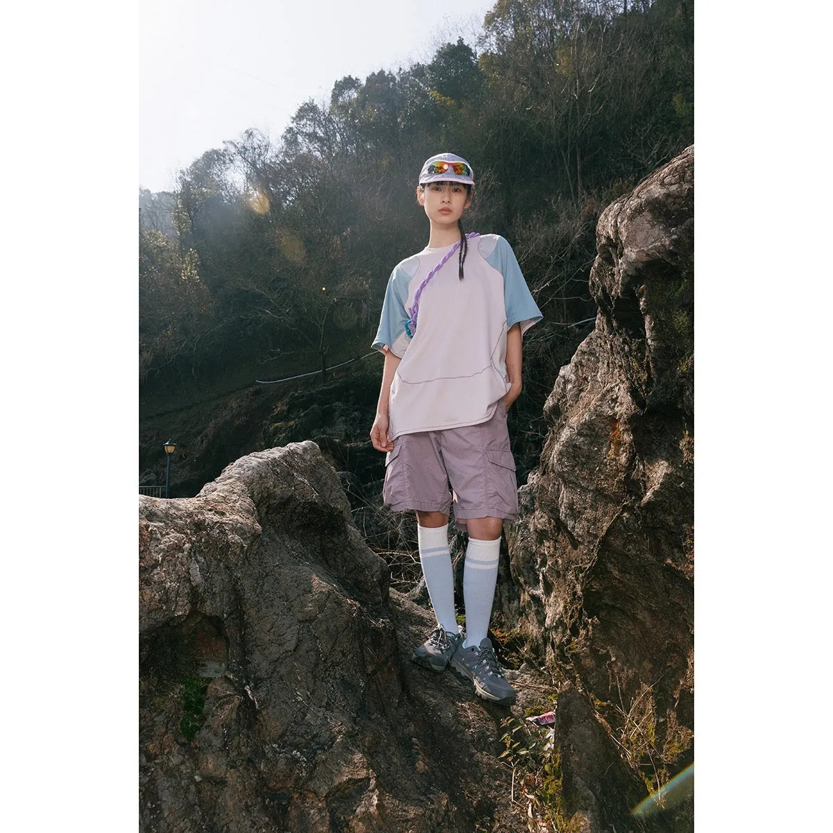 Man wearing a loose blue patchwork contrast colour short sleeve cotton blend sports t-shirt.
