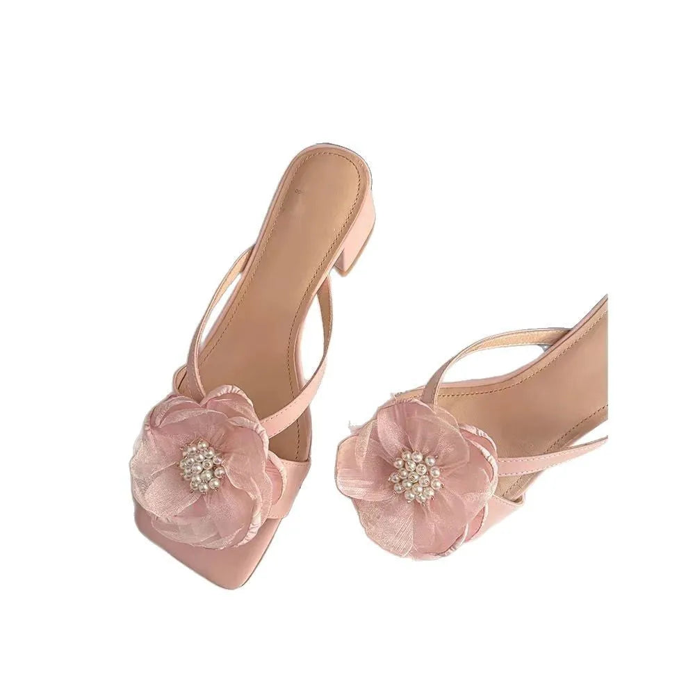 Women's cream-white sandals with chunky heel, square toe, one-line strap, and a decorative flower on the satin upper.