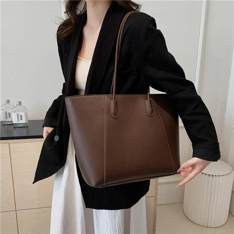 PU leather soft bucket shoulder tote bag with synthetic leather lining, outer sandwich pocket and zipper change bag
