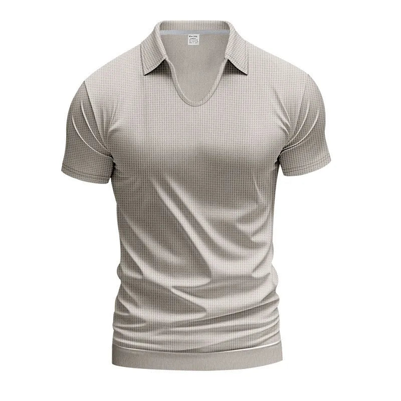 Man modelling a loose-fit apricot coloured V-neck short-sleeve T-shirt for casual summer wear.