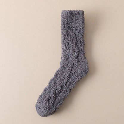 Plush coral fleece socks in various colors, designed for cozy and comfortable home wear
