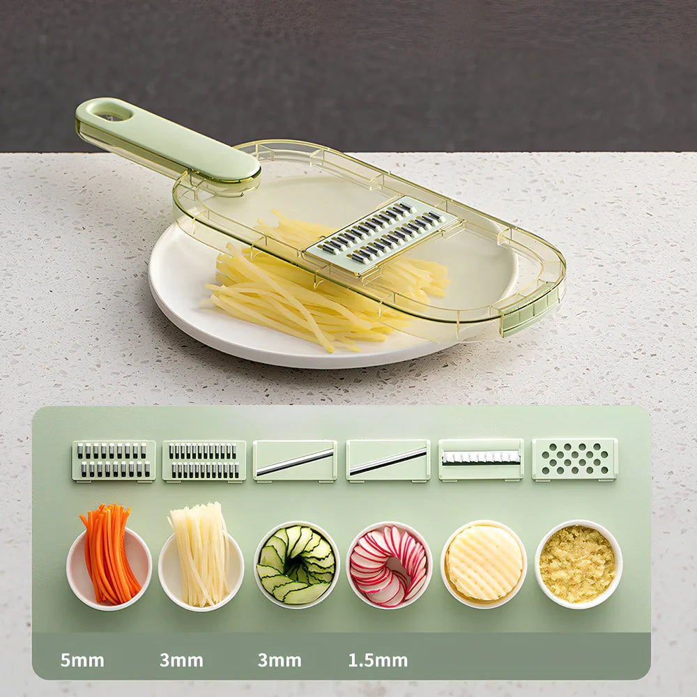 Shredded vegetable slicer with stainless steel blades on green cutting board