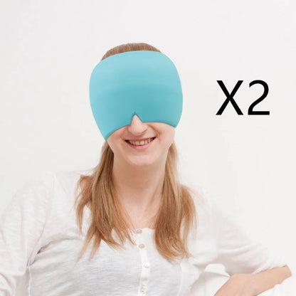 Black elastic cloth gel cold compress eye mask for headache relief on a grey background.