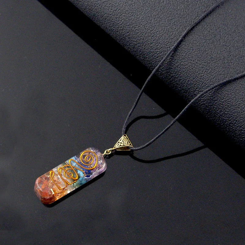 Handcrafted natural crystal seven chakra pendant with unique geometric design