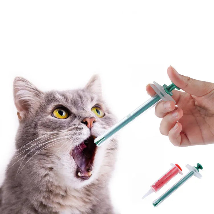 Two silicone-tipped pet pill shooter syringes for cat and dog medicine.