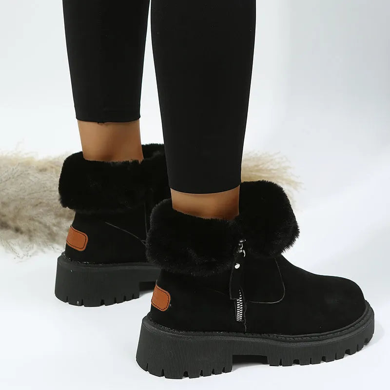 Women's black faux suede high-top snow boots with a side zipper and fur-lined collar.