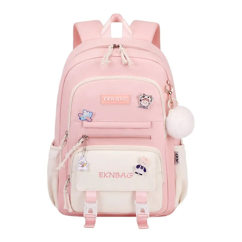 Pink waterproof school backpack for girls with curved ergonomic shoulder straps, shown with matching pencil case.