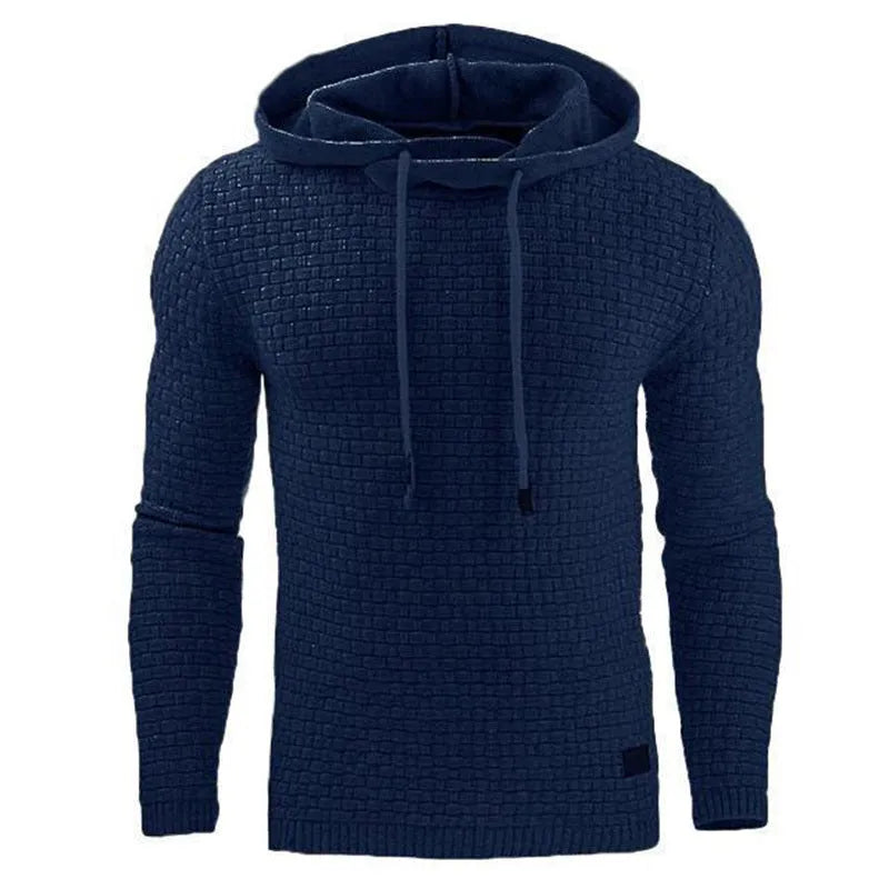 A man wearing a cotton-polyester blend hoodie available in nine colours including black, navy, and red.
