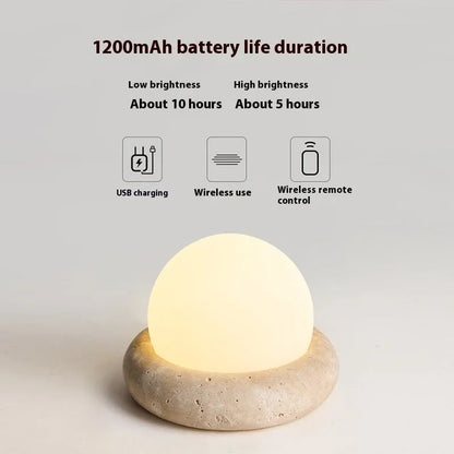 Cream coloured bedside night lamp with remote control measuring 15.5cm diameter