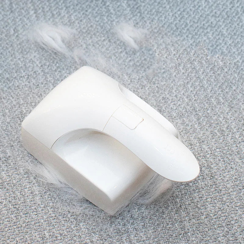 White ABS plastic reusable pet hair remover roller for cat and dog fur on fabrics.