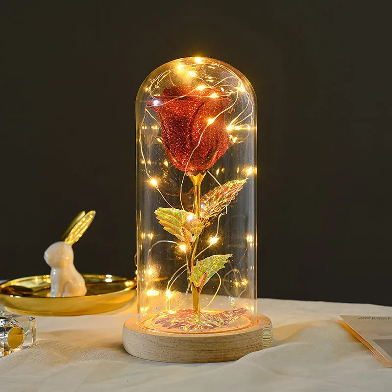 Eternal rose in glass dome with LED string lights, colour options include red, gold, grey, rose red, blue, pink