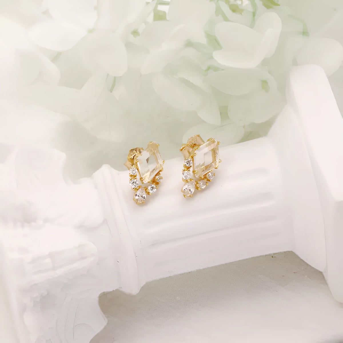Geometric sterling silver ear studs with sweet white crystal stones