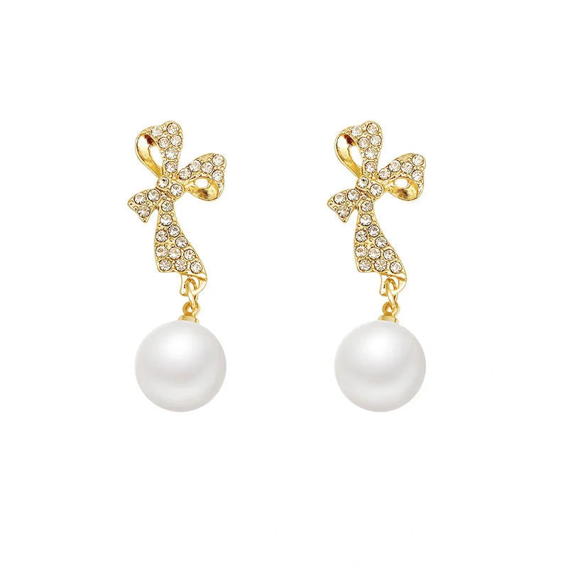 Elegant gold bow diamond crystal earrings for women, perfect for adding a touch of glamour to any outfit.