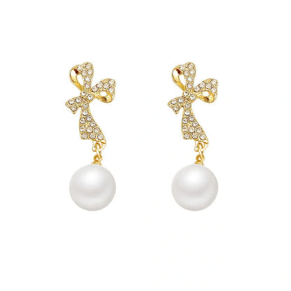 Elegant gold bow diamond crystal earrings for women, perfect for adding a touch of glamour to any outfit.