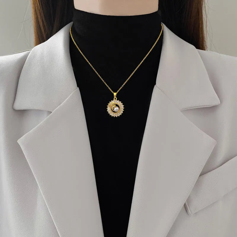 Women's geometric leaves design jewellery set with titanium steel necklace and gold plated stud earrings.