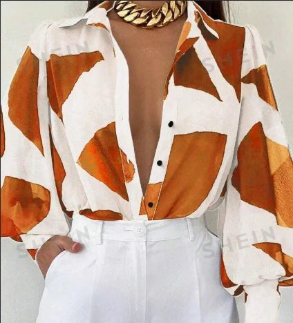Elegant floral blouse with lantern sleeves, perfect for spring and summer fashion