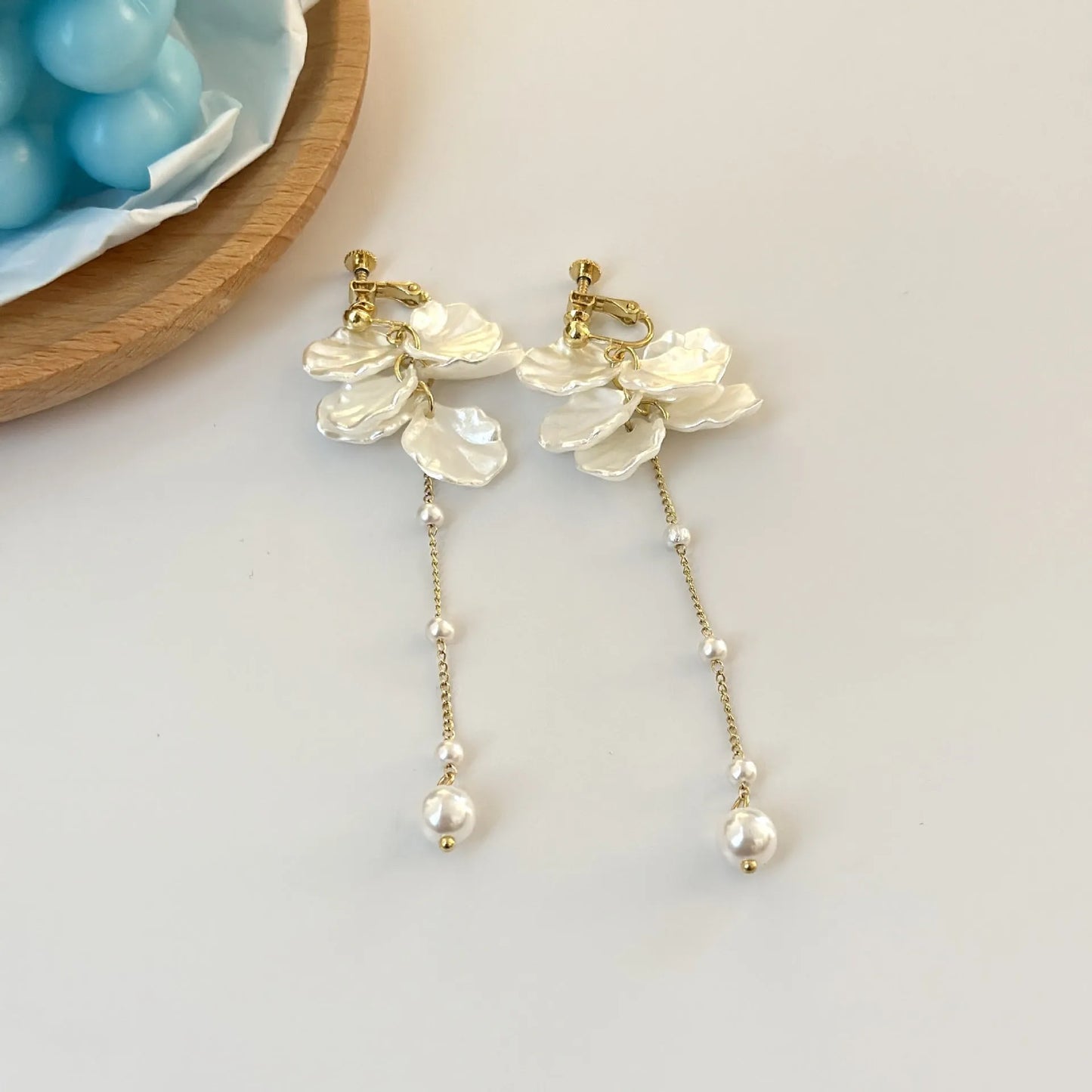 Women's acrylic shell pearl tassel earrings showing four ear clip types and casual style design