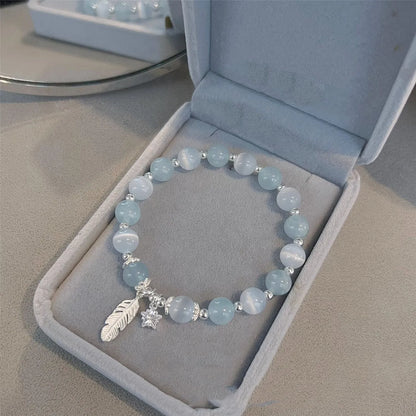 Small white girl crystal bracelet with blue moonlight feather charm and Korean style design
