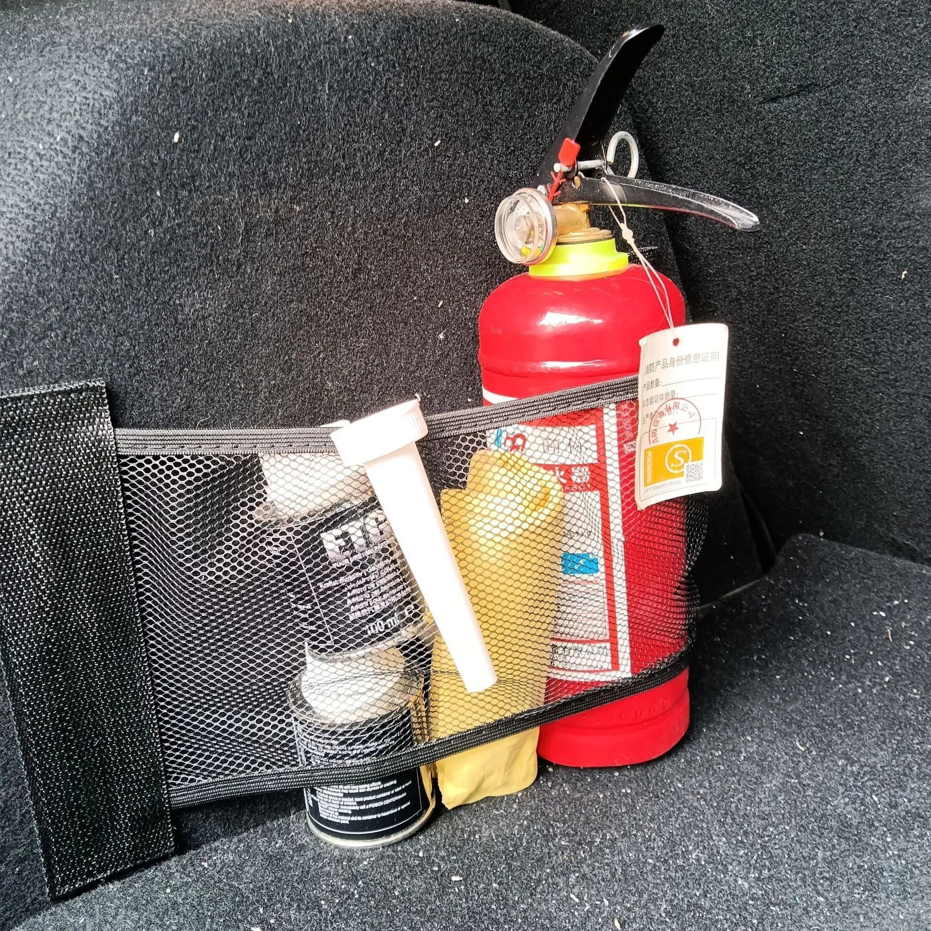 Elastic car boot storage net in polyester material for organising loose items in luggage compartment