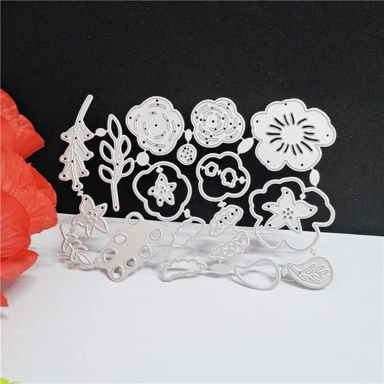 Silver carbon steel floral cutting die for paper crafts measuring 14.3 by 9.9 cm.