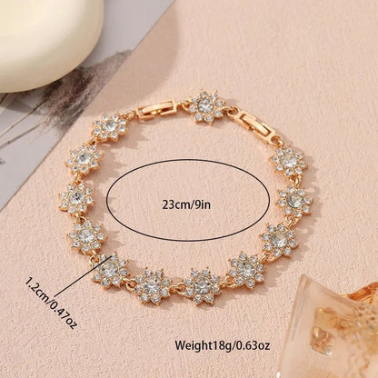 Gold and silver electroplated bracelets with flower charms set with coloured gemstones.