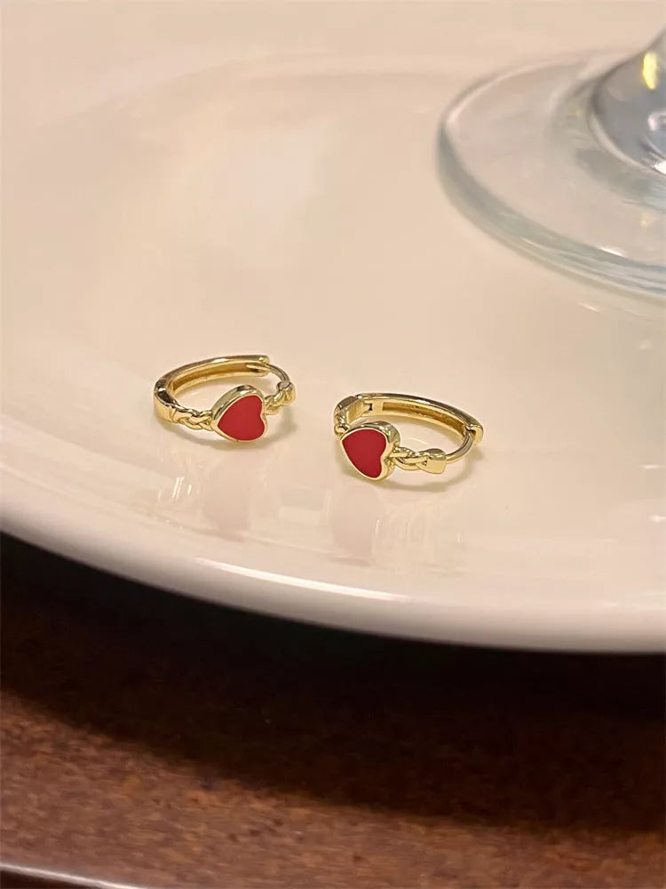 Black love heart earrings for women with alloy construction and ear clip design