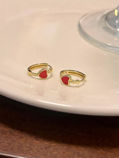 Black love heart earrings for women with alloy construction and ear clip design