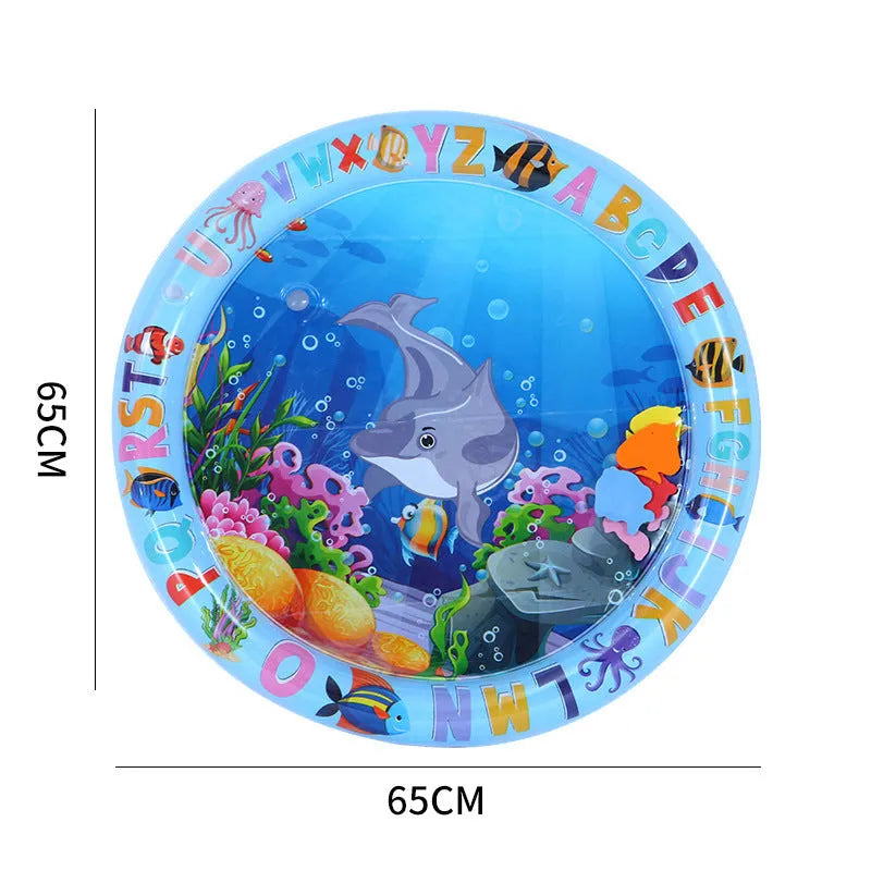 Blue ocean-themed cat water play mat with floating fish toys inside an inflated square border on a wooden floor.