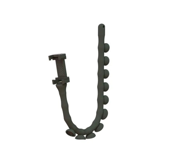 Flexible black rubber phone holder with suction cup mounted on a desk, holding a mobile phone at eye level.