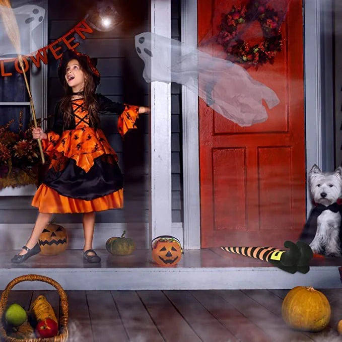 Halloween witch leg garden decoration with striped stockings and black boots