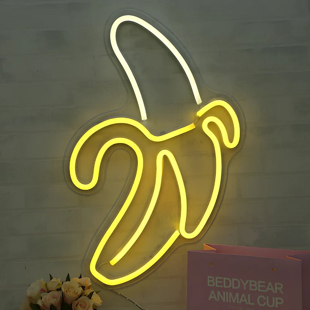 USB-powered neon wall lamp showing Banana shape with pink lighting against dark wall